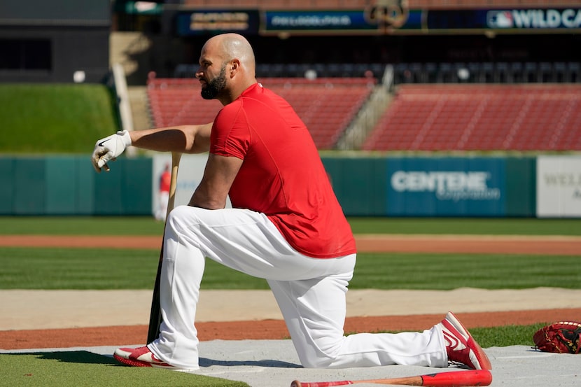 St. Louis Cardinals designated hitter Albert Pujols pauses while taking batting practice...