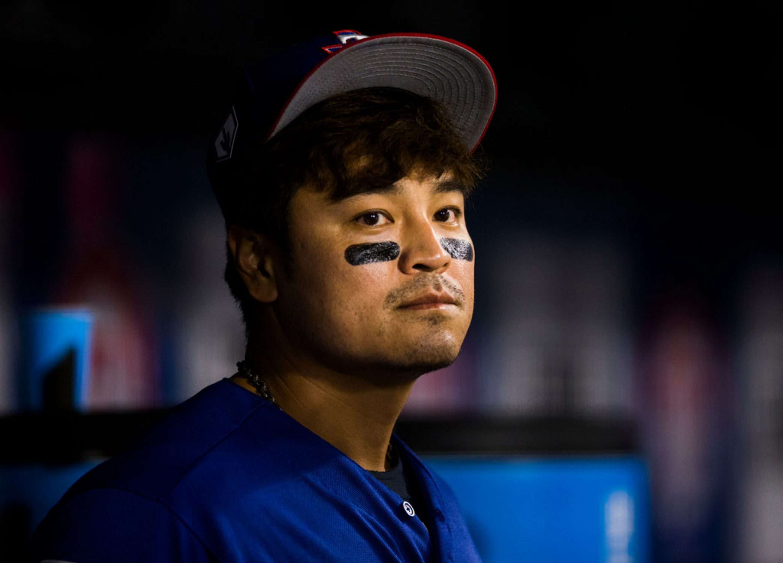 Texas Rangers designated hitter Shin-Soo Choo (17) watches from the dugout during the fifth...