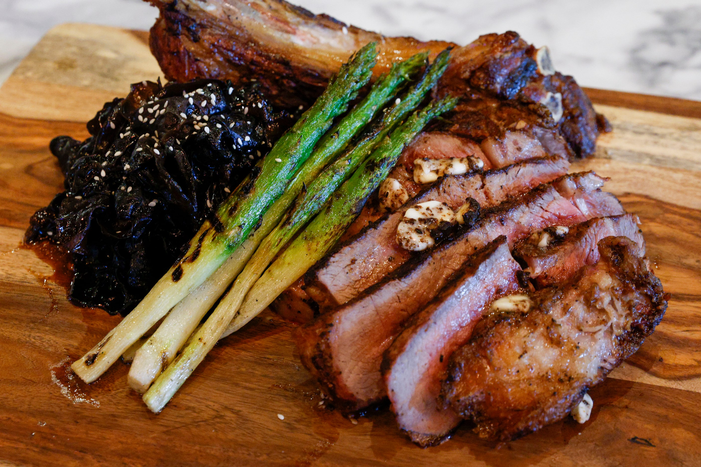 Tomahawk steak served with elephant ear mushrooms and asparagus at Snowbird, Thursday, Oct....