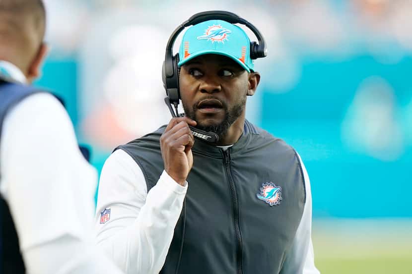 Miami Dolphins head coach Brian Flores talks on the sidelines during the first half of an...