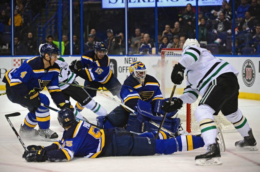 Feb 16, 2016; St. Louis, MO, USA; St. Louis Blues goalie Brian Elliott (1) defenseman Carl...