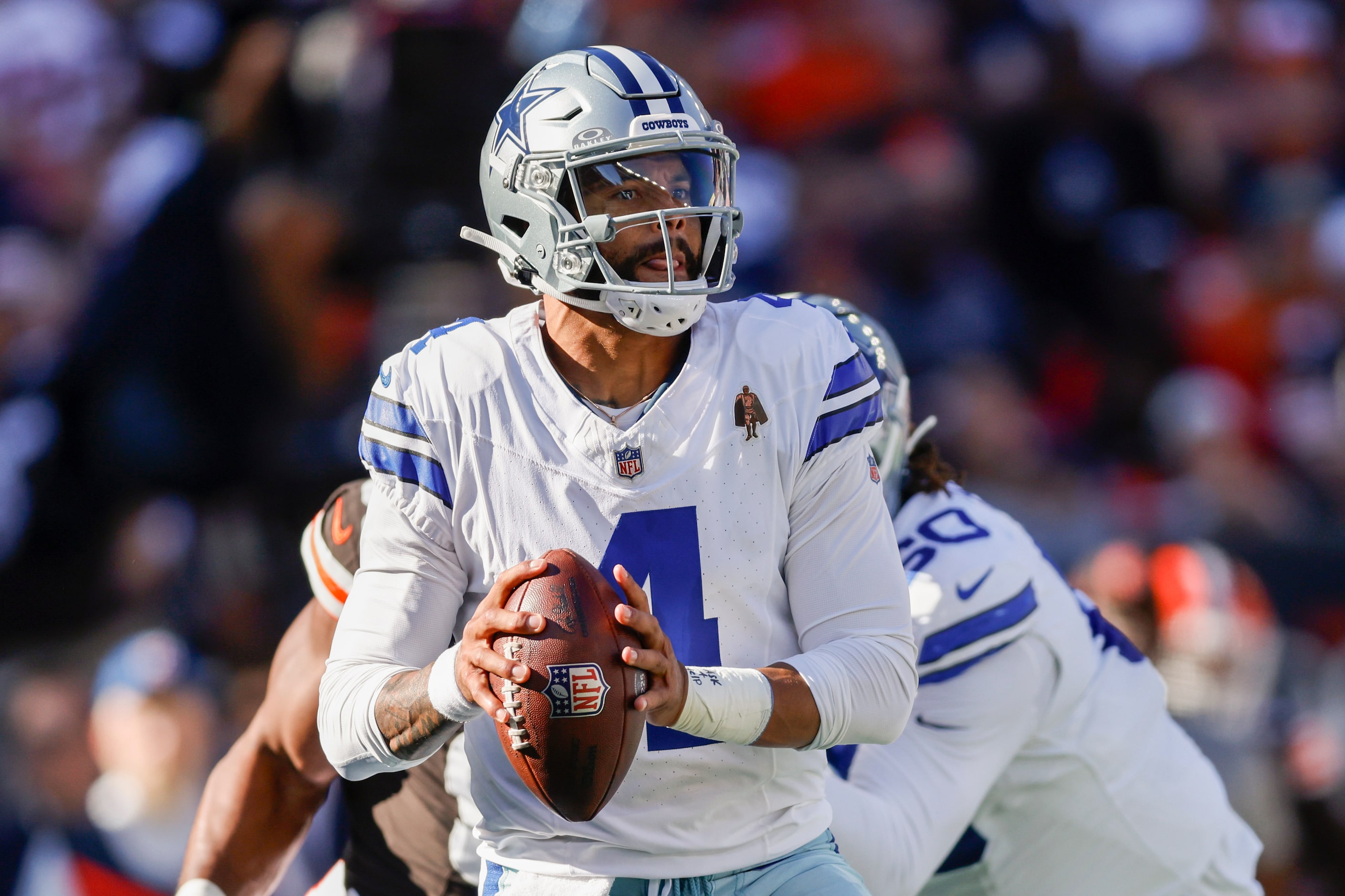 Dallas Cowboys quarterback Dak Prescott (4) drops back to pass during the first half against...