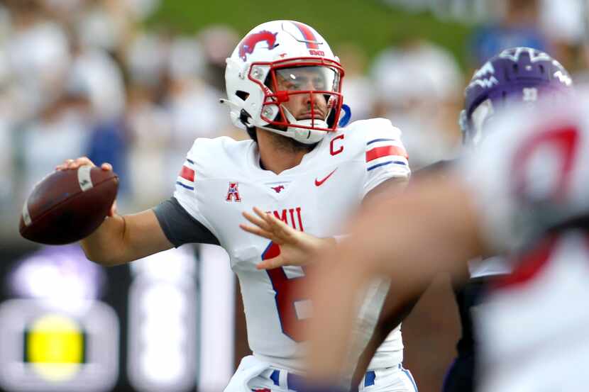 SMU quarterback Tanner Mordecai (8) looks to pass during the first half against Abilene...