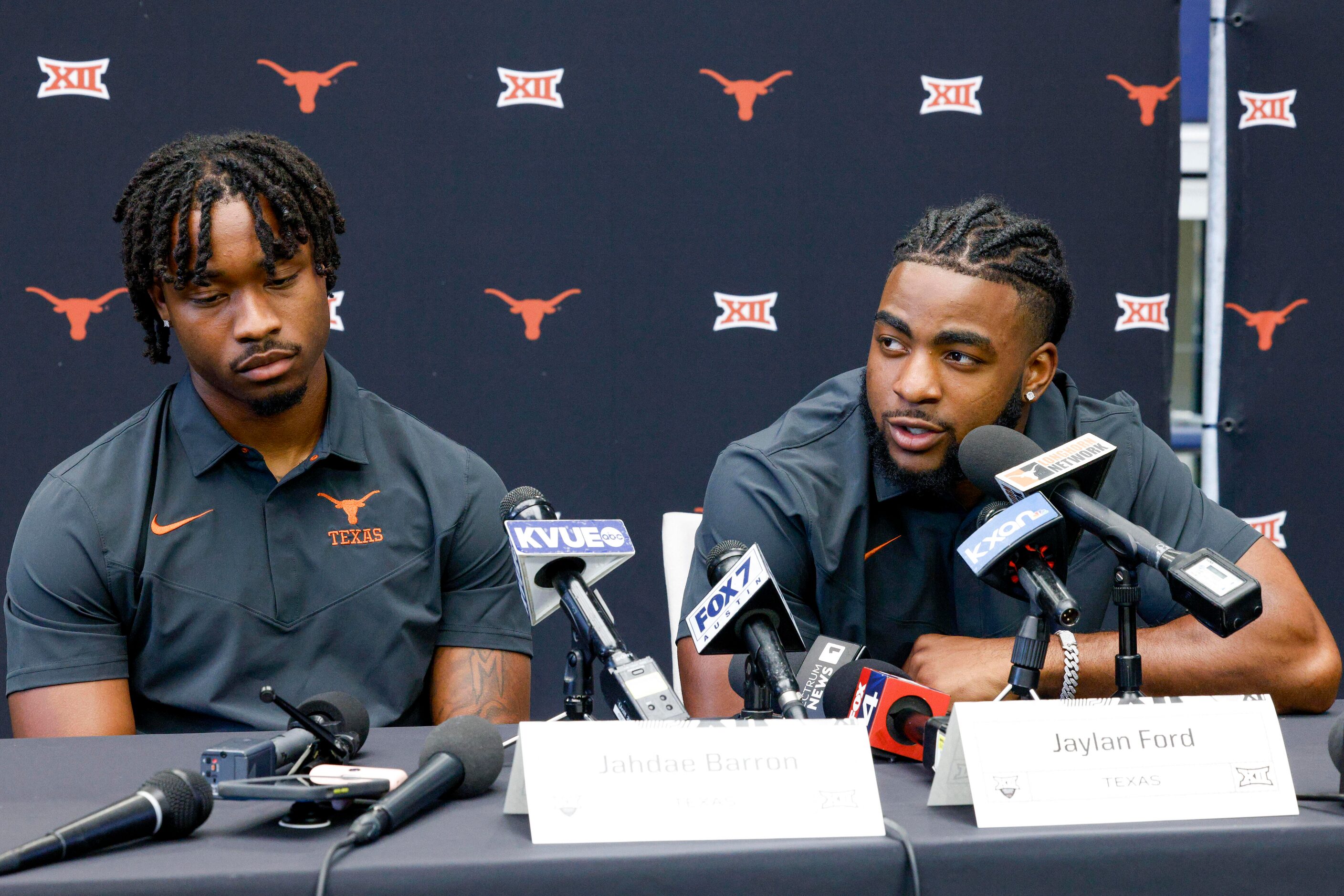 Texas linebacker Jaylan Ford (right) speaks to reporters alongside defensive back Jahdae...