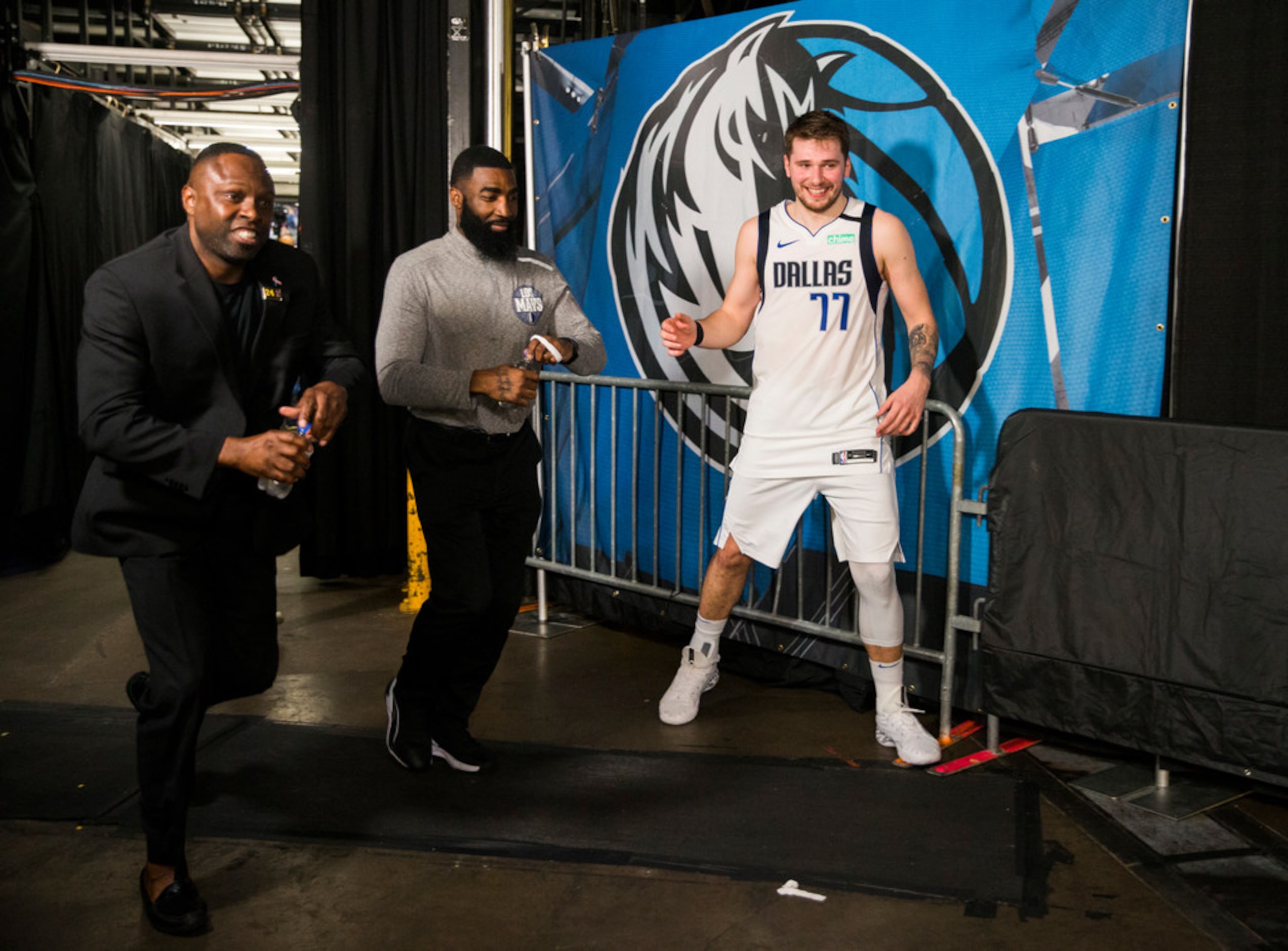 Crews break down the court after the Dallas Mavericks beat the Denver Nuggets 113-97 on...