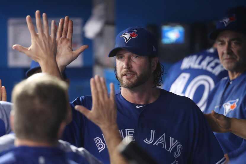 TORONTO, ON - JUNE 13: Jason Grilli #37 of the Toronto Blue Jays is congratulated by...