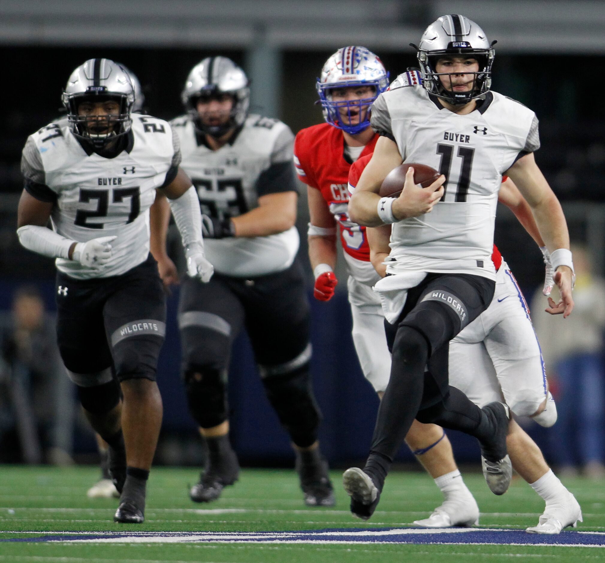 Denton Guyer quarterback Jackson Arnold (11) rambles into the Austin Westlake secondary for...