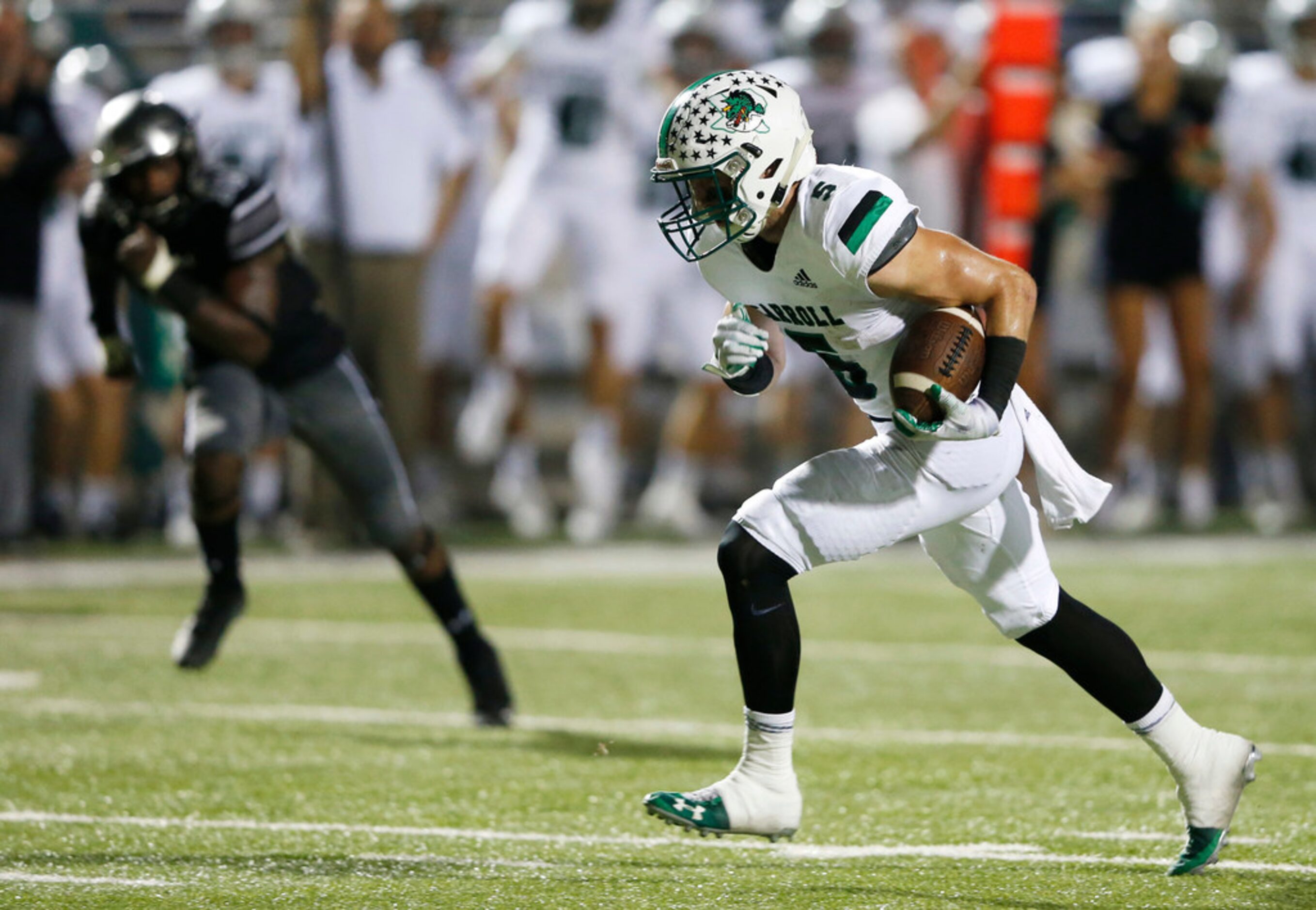 Southlake Carroll's Wills Meyer (5) breaks away from  Denton Guyer's Seth Meador (19) for a...