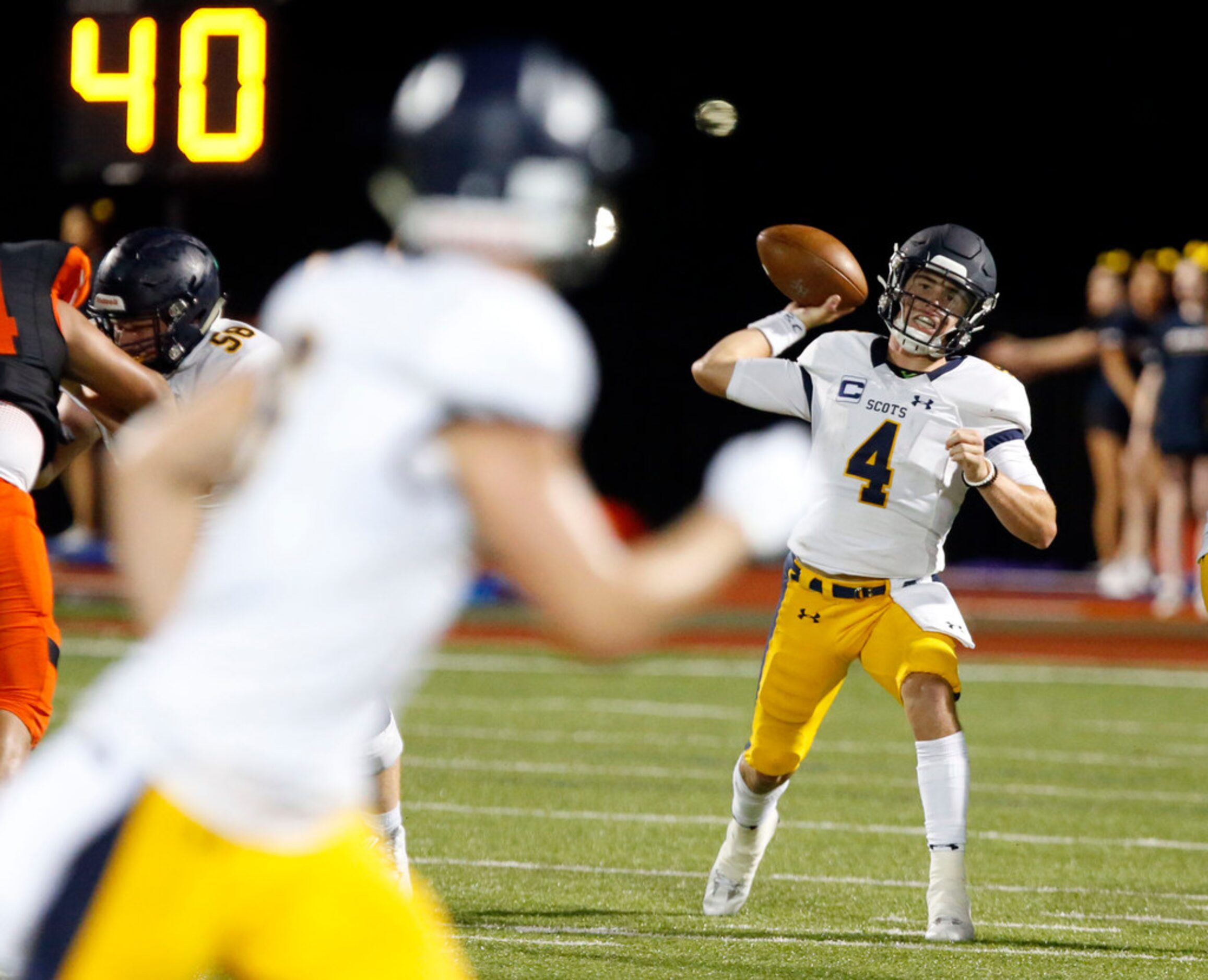 Highland Park quarterback Chandler Morris (4) throws a pass during the first half of the...