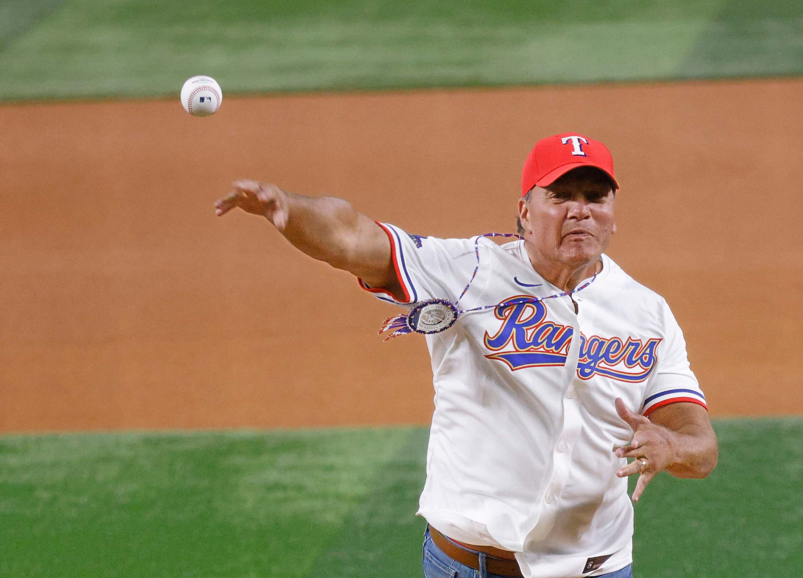 Gary Batton, chief of Choctaw Nation throws out a ceremonial first pitch before a baseball...