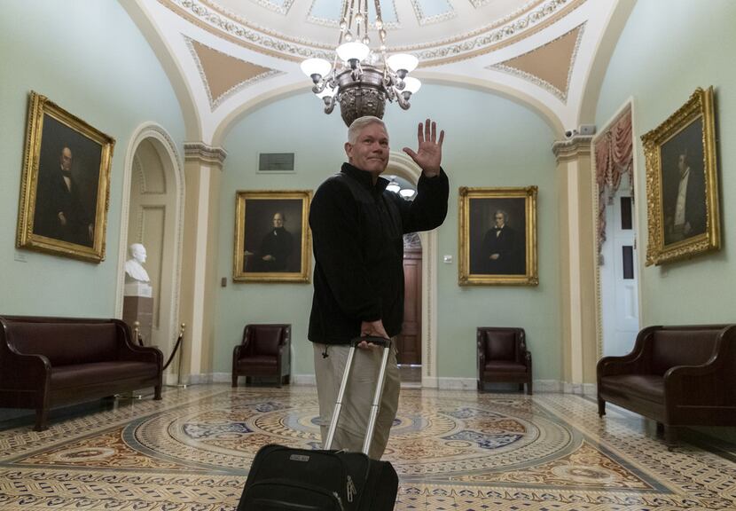 Rep. Pete Sessions waved to reporters as he departed the U.S. Capitol on Dec. 22, 2018.