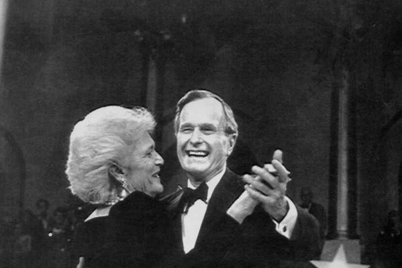 President George H.W. Bush and his wife, Barbara, dance at his inaugural ball in Washington,...