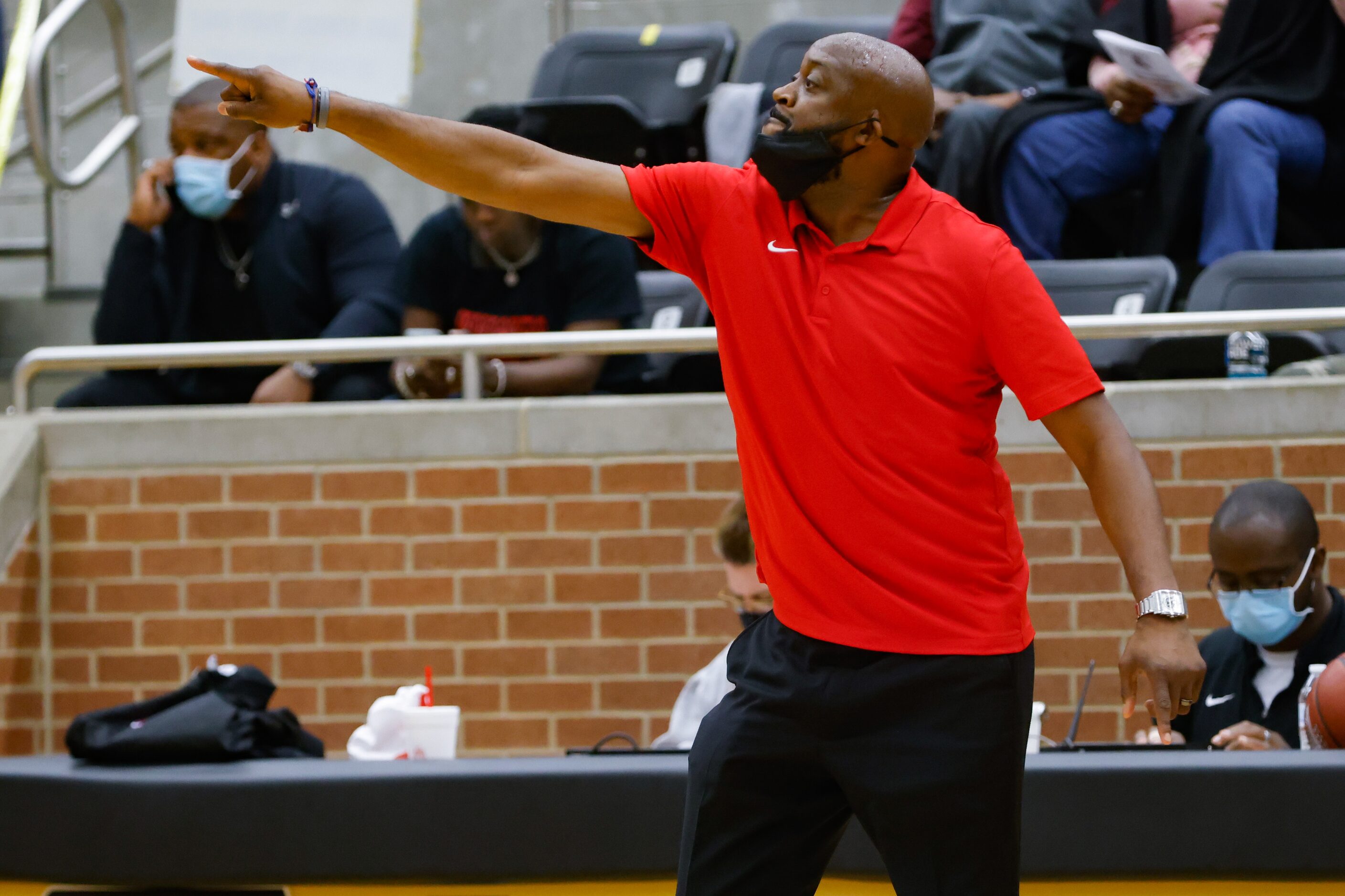 Kimball coach Nicke Smith during the first half of a boys basketball UIL Class 5A Region II...