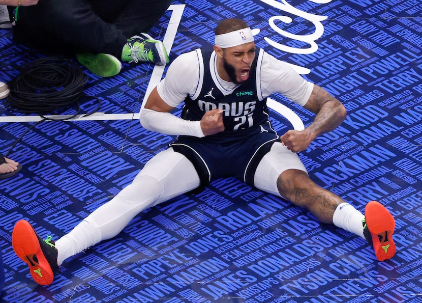 Dallas Mavericks center Daniel Gafford (21) reacts after dunking the ball over Minnesota...