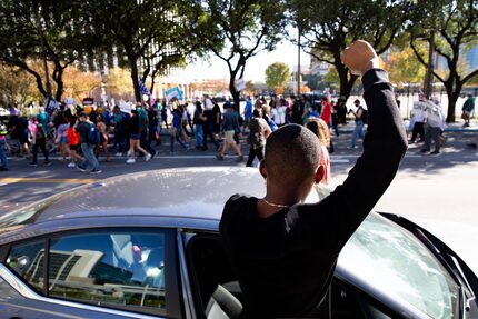 Jakori Handsbur raised his fist in solidarity with demonstrators.