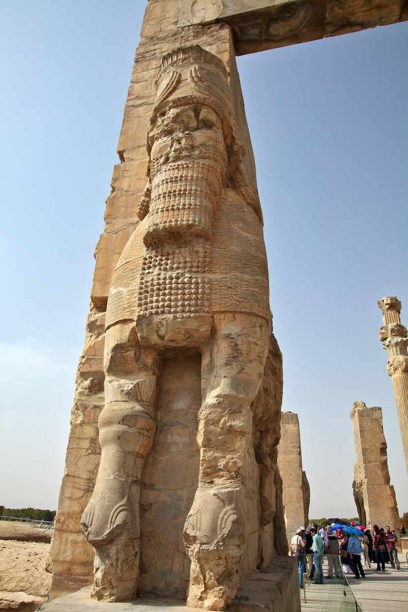 
Gigantic stone Lamassus figures stand guard at the Gate of All Nations in the ruins of...
