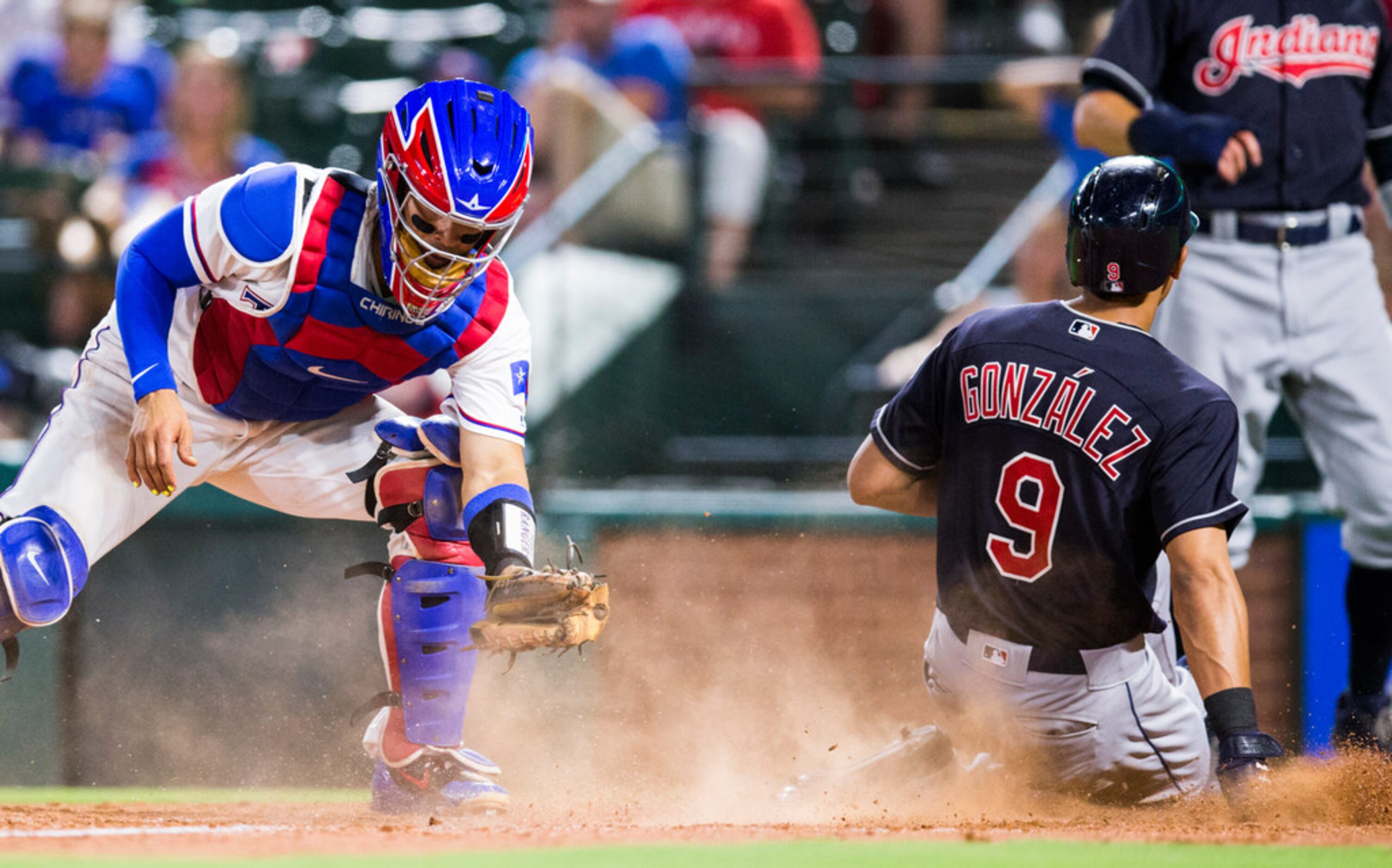 Texas Rangers catcher Robinson Chirinos (61) catches a throw to home plate as Cleveland...