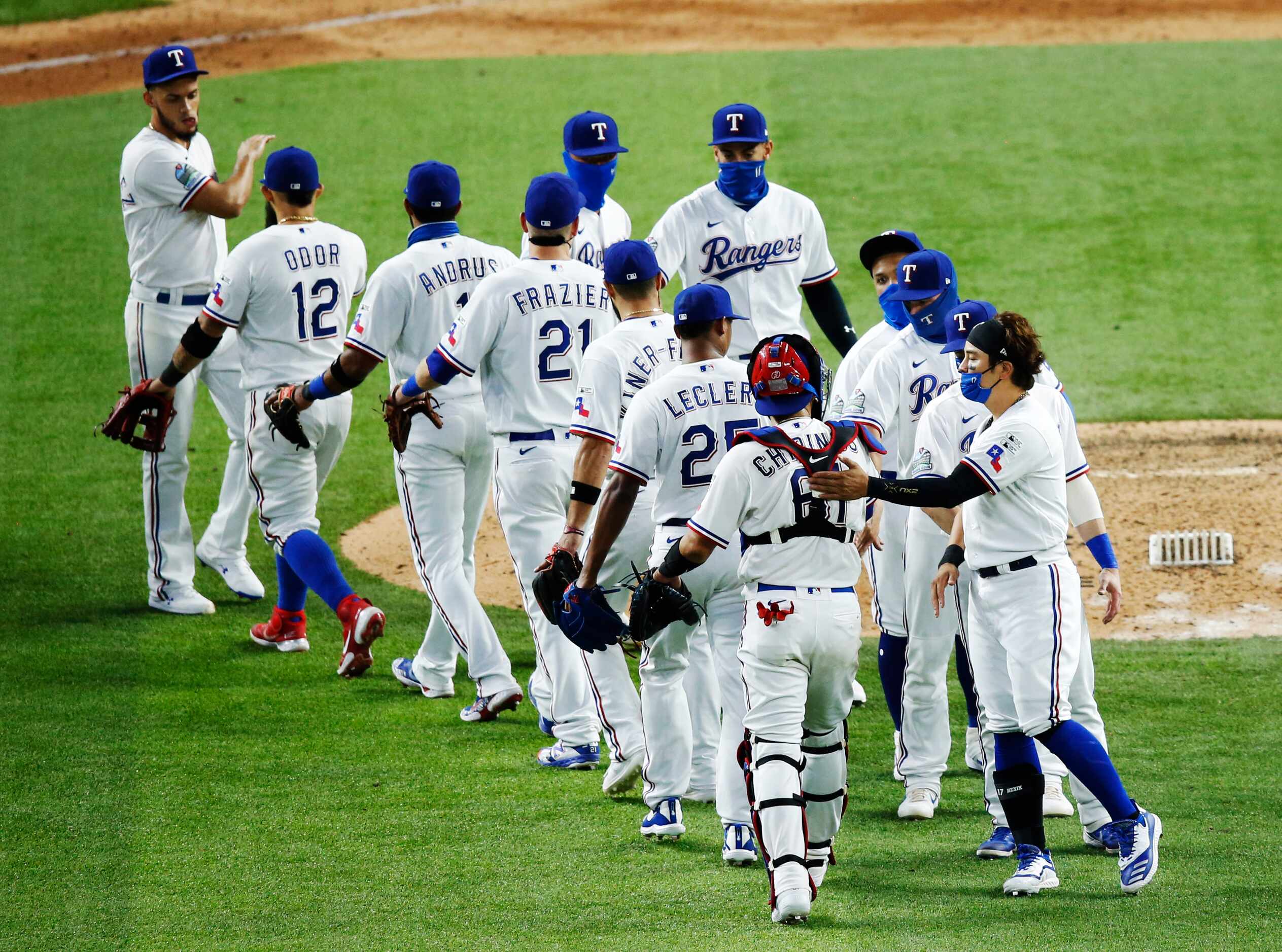 Texas Rangers left fielder Shin-Soo Choo (17) celebrates with Texas Rangers catcher Robinson...