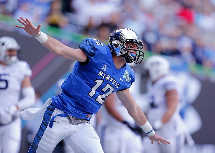 MIAMI, FL - DECEMBER 22: Paxton Lynch #12 of the Memphis Tigers reacts after throwing a...