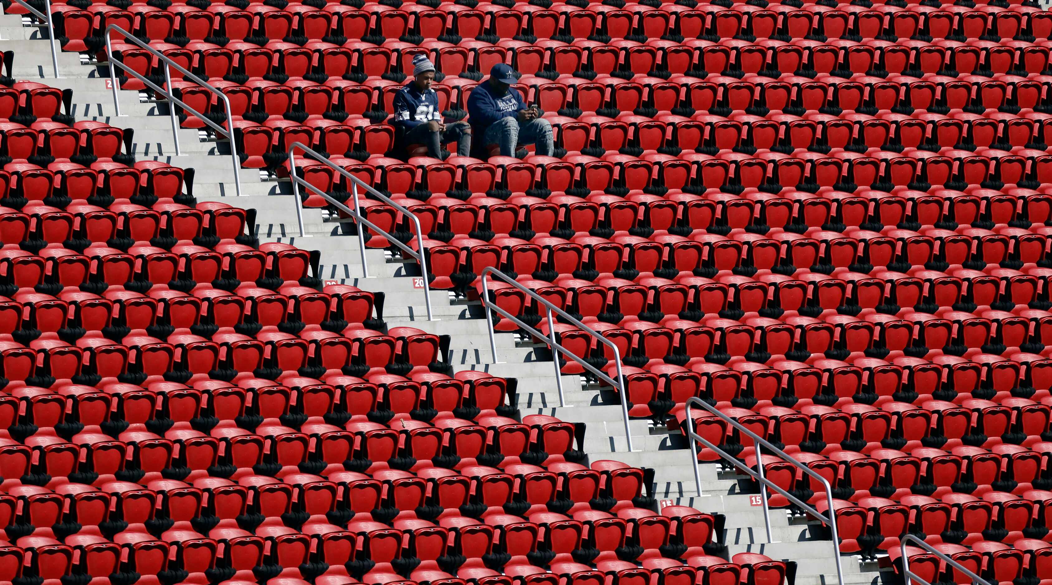 A pair of Dallas Cowboys fans got to their seats early at  Levi’s Stadium in Santa Clara,...