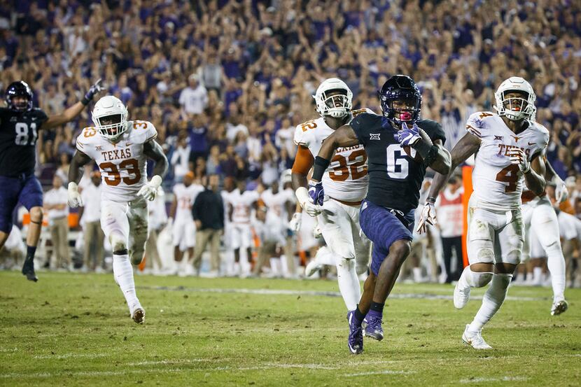 FILE - TCU running back Darius Anderson (6) breaks through the Texas defense to score on a...
