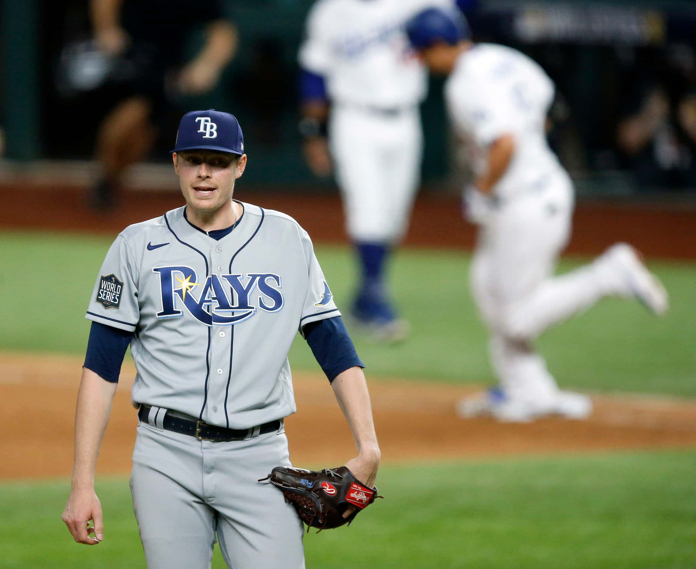Tampa Bay Rays relief pitcher Peter Fairbanks (29) reacts after giving up a s solo home run...
