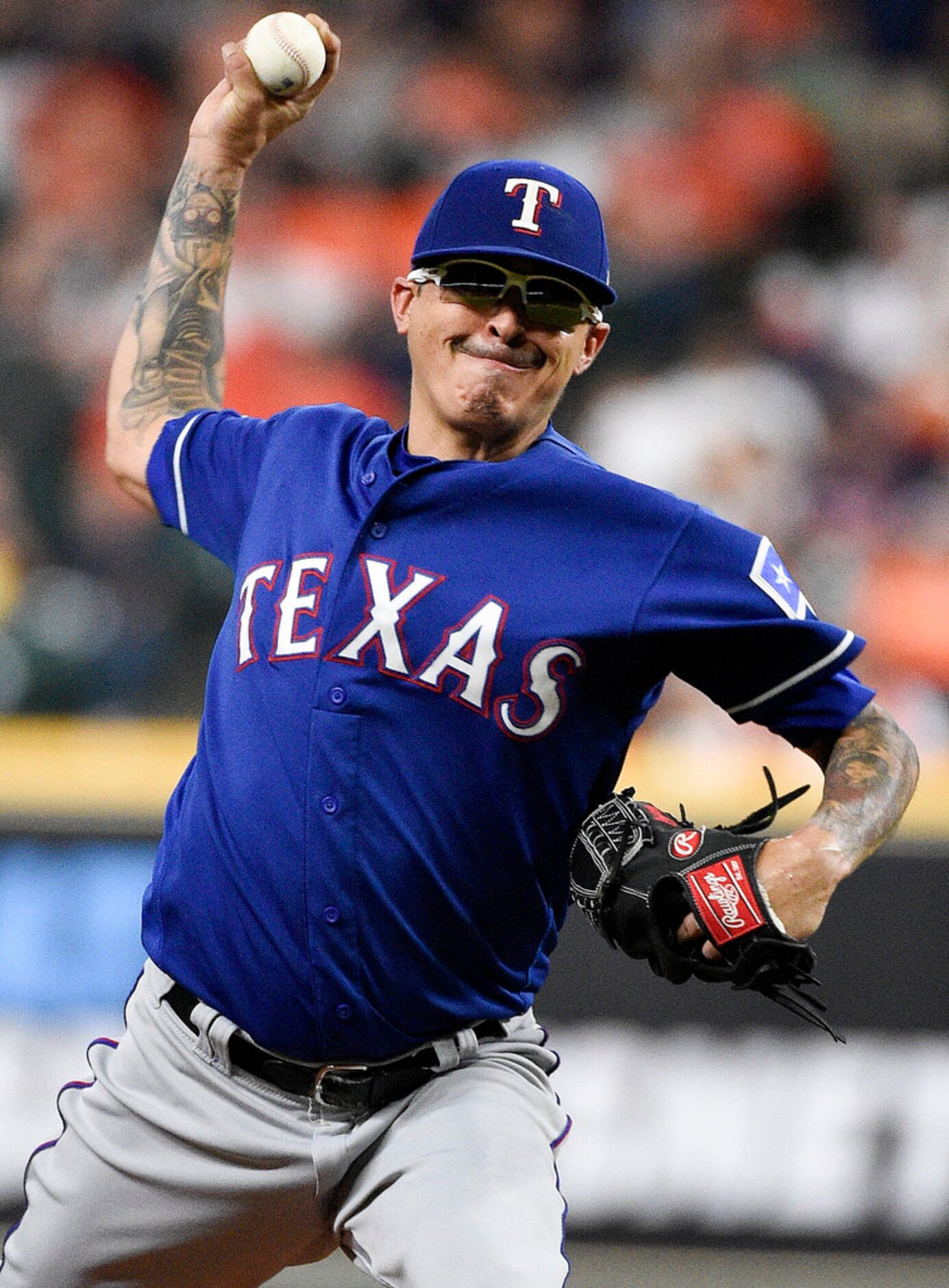 Texas Rangers starting pitcher Jesse Chavez delivers during the first inning of the team's...