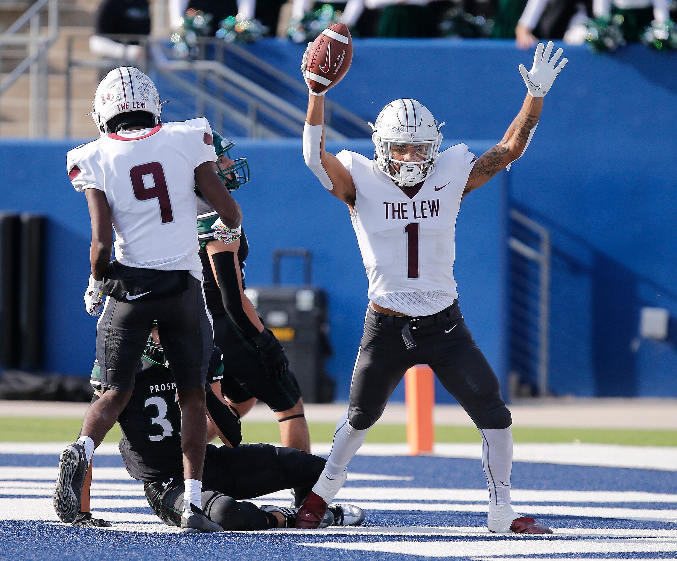 Lewisville High School wide receiver Jaydan Hardy (1) reacts to scoring a touchdown during...