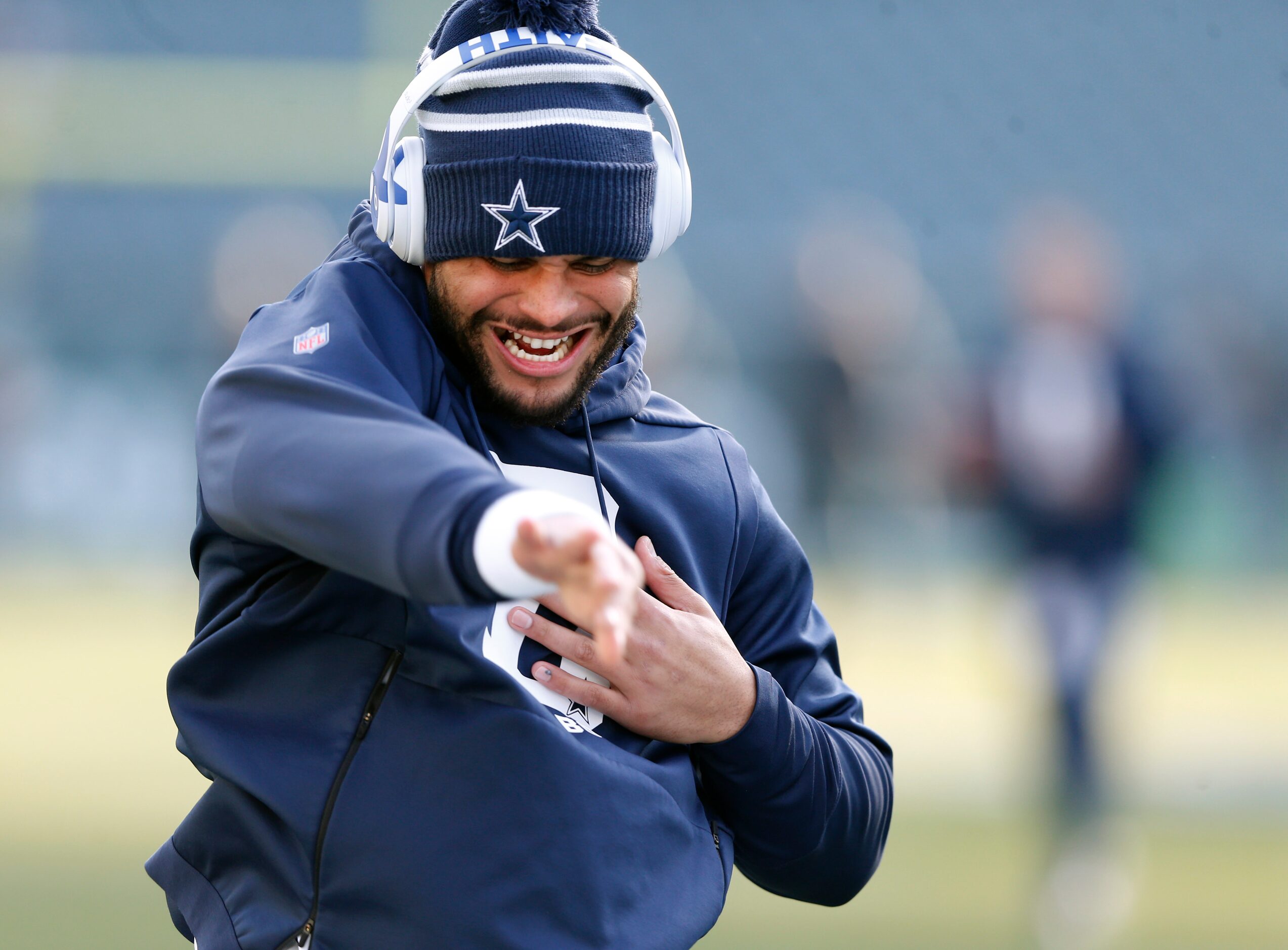 Dallas Cowboys quarterback Dak Prescott (4) stretches before warmups prior to a game against...