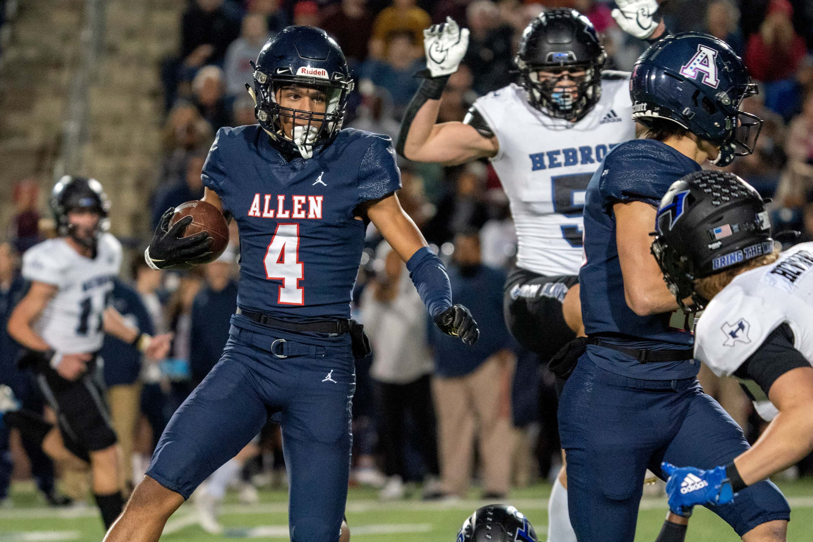 Allen senior wide receiver Jordyn Tyson (4) looks for yards after the catch on a reception...