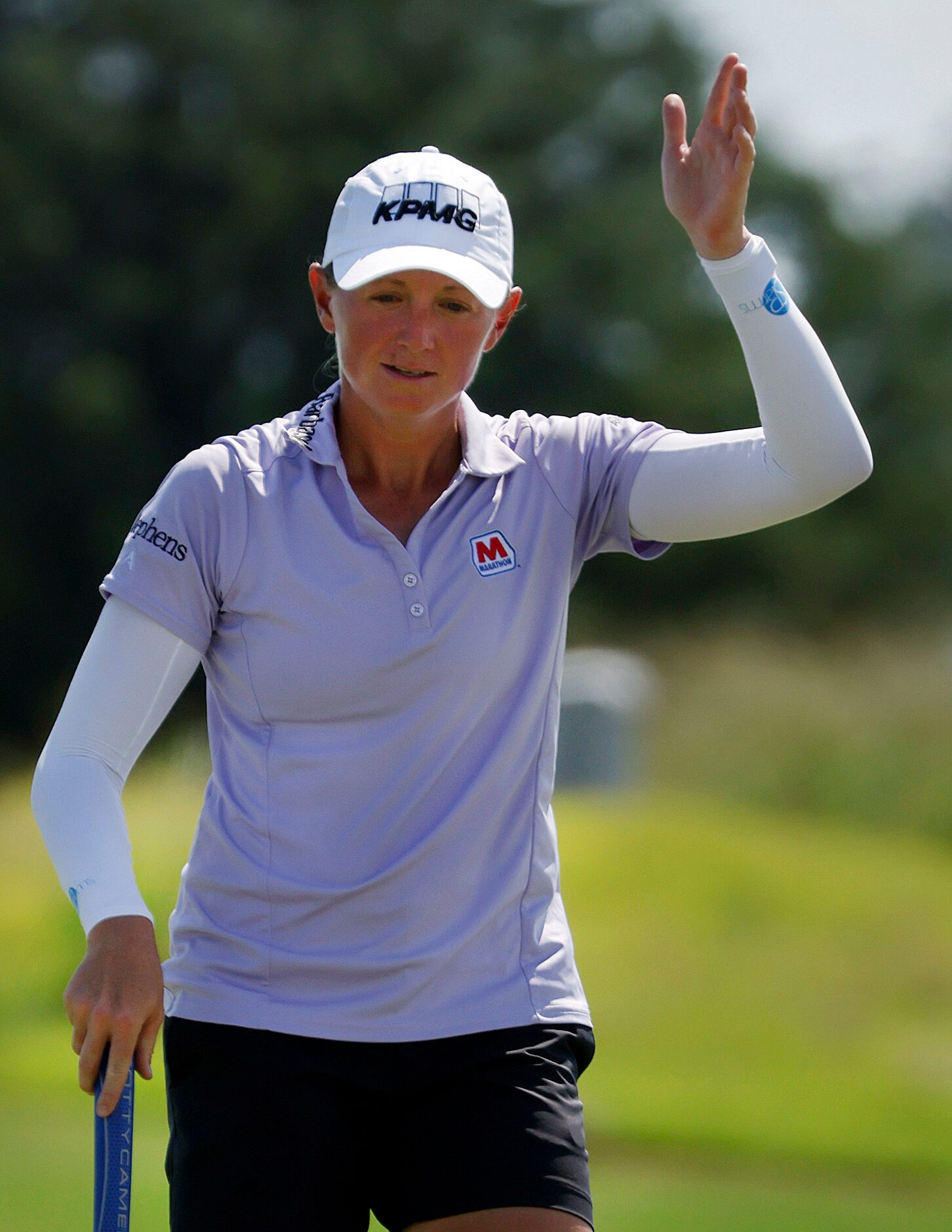 Professional golfer Stacy Lewis of The Woodlands, Texas waves after sinking a long birdie on...