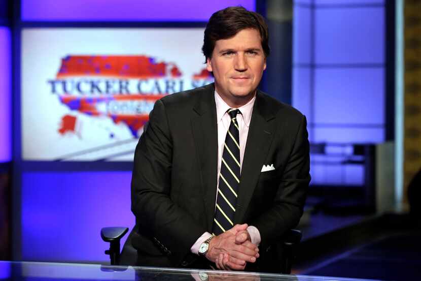 In this March 2, 2017, file photo, Tucker Carlson, host of "Tucker Carlson Tonight," poses...