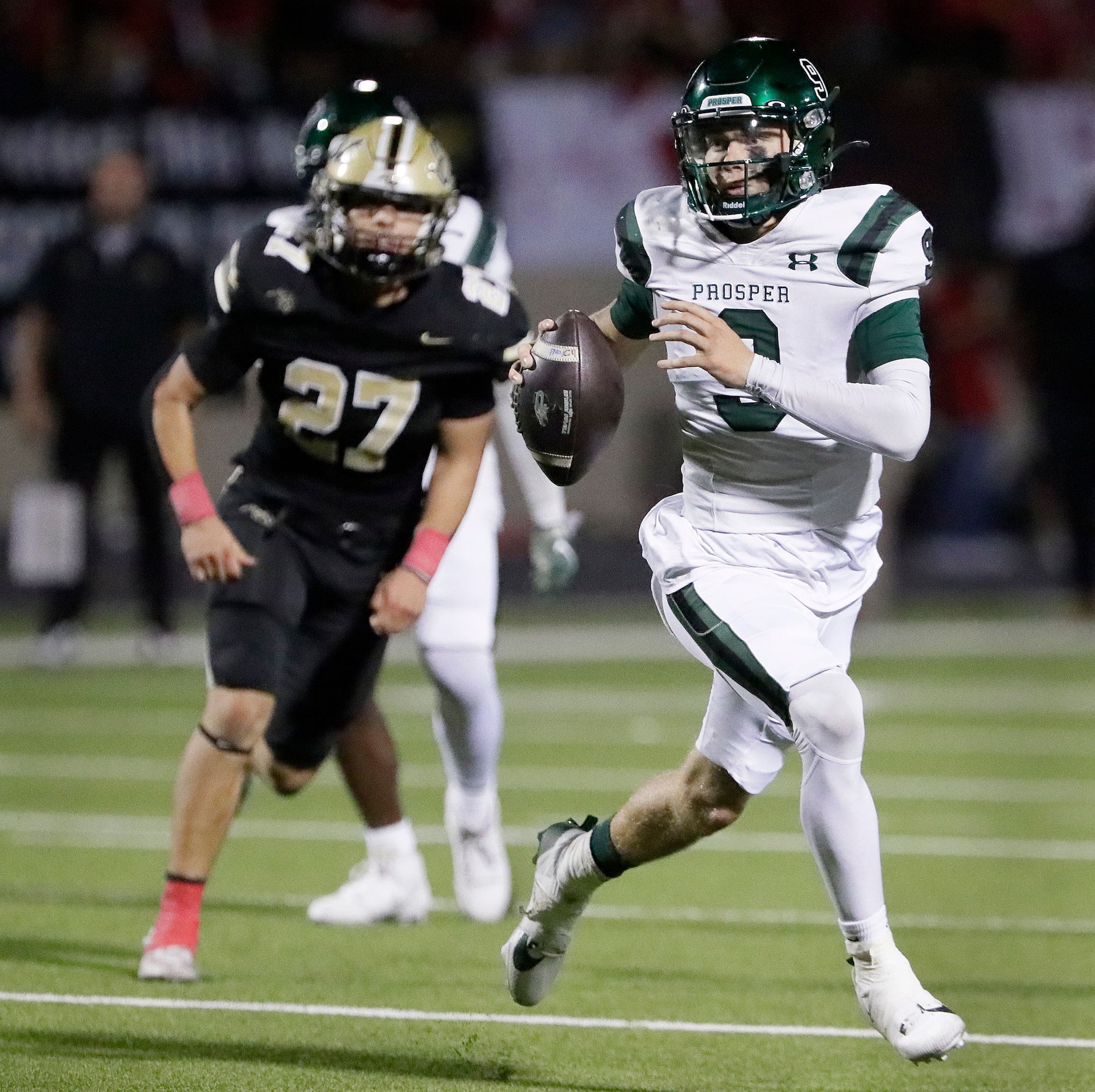 Prosper High School quarterback Braeden Imhoff (9) scrambles during the first half as Plano...