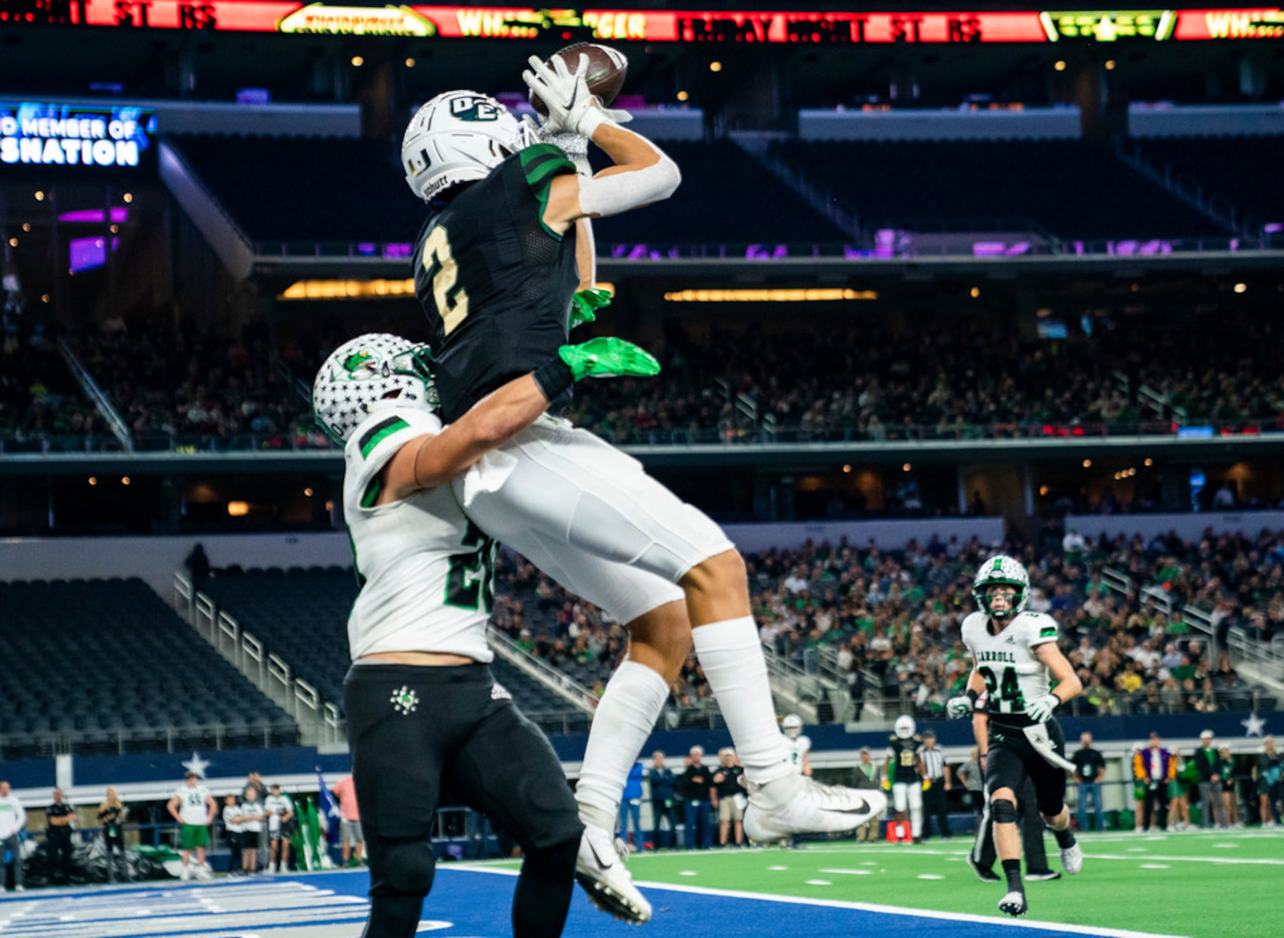 DeSoto wide receiver Lawrence Arnold (2) catches a pass in the end zone for a touchdown over...