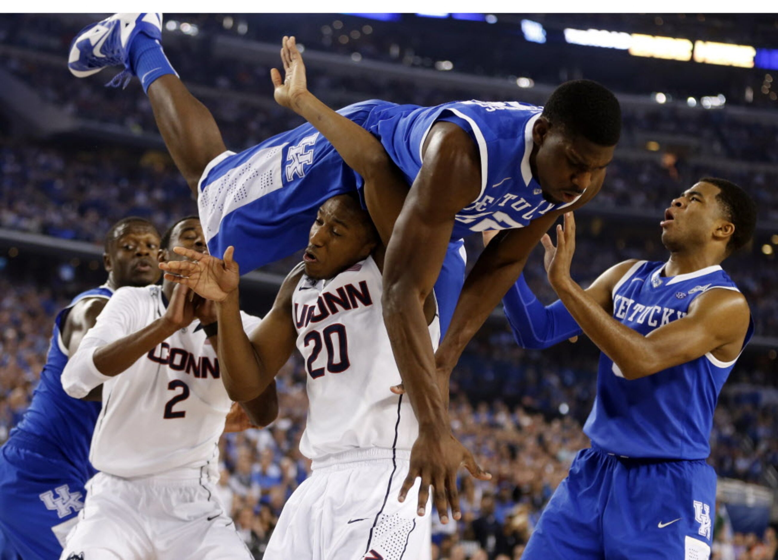 Connecticut Huskies guard/forward Lasan Kromah (20) is fouled by Kentucky Wildcats forward...