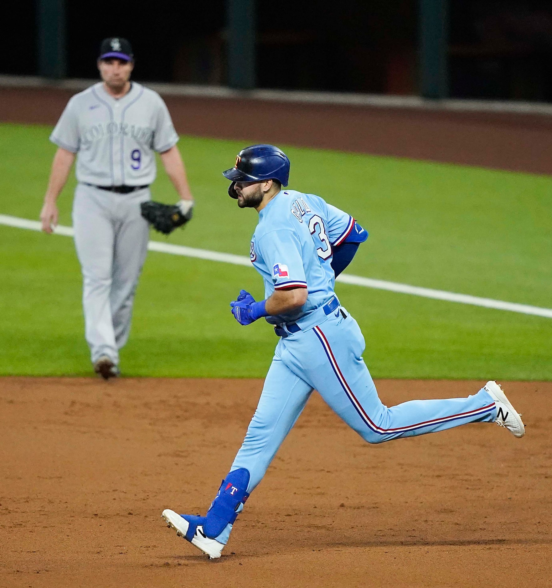 Texas Rangers outfielder Joey Gallo rounds the bases after hitting the first official home...