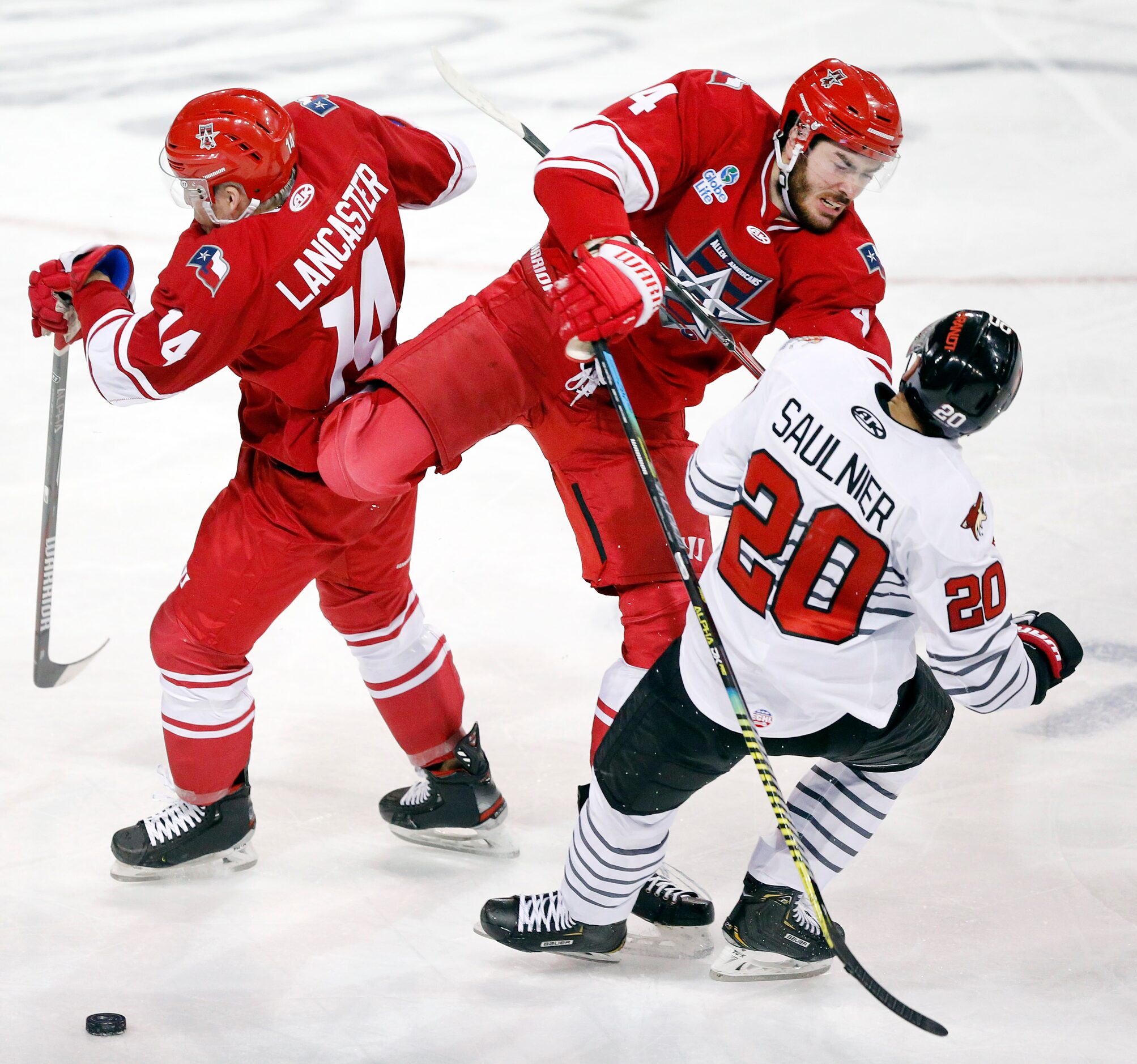 Allen Americans defenseman Turner Ottenbreit (4) gives a check to Rapid City Rush forward...