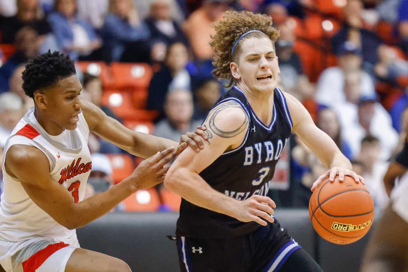 Byron Nelson High School' Finley Bizjack (3) evades a block from Lake Highlands High...