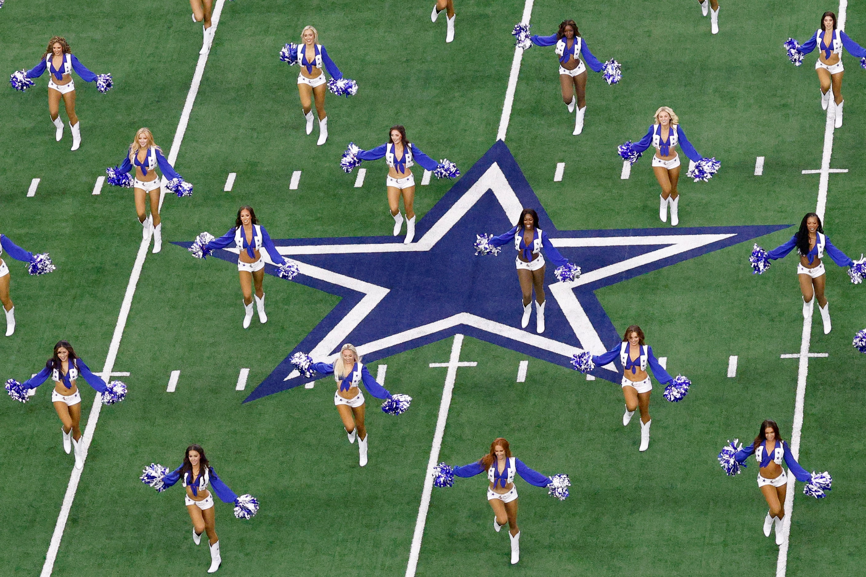 Dallas Cowboys cheerleaders perform before an NFL football game against the New Orleans...