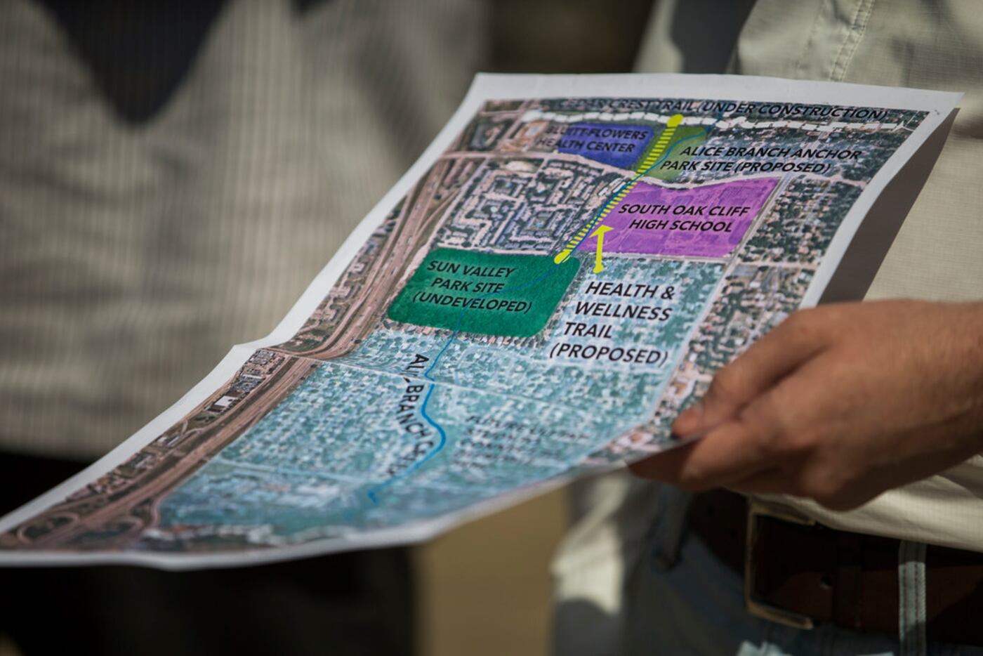 Robert Kent of The Trust for Public Land holds a map showing where the parks and trails...