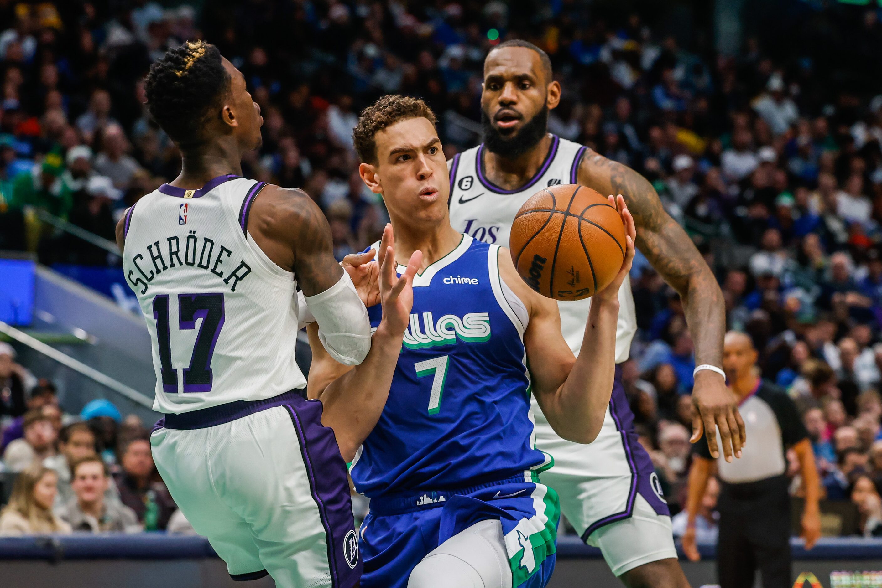 Dallas Mavericks center Dwight Powell (7) reacts as Los Angeles Lakers guard Dennis Schroder...