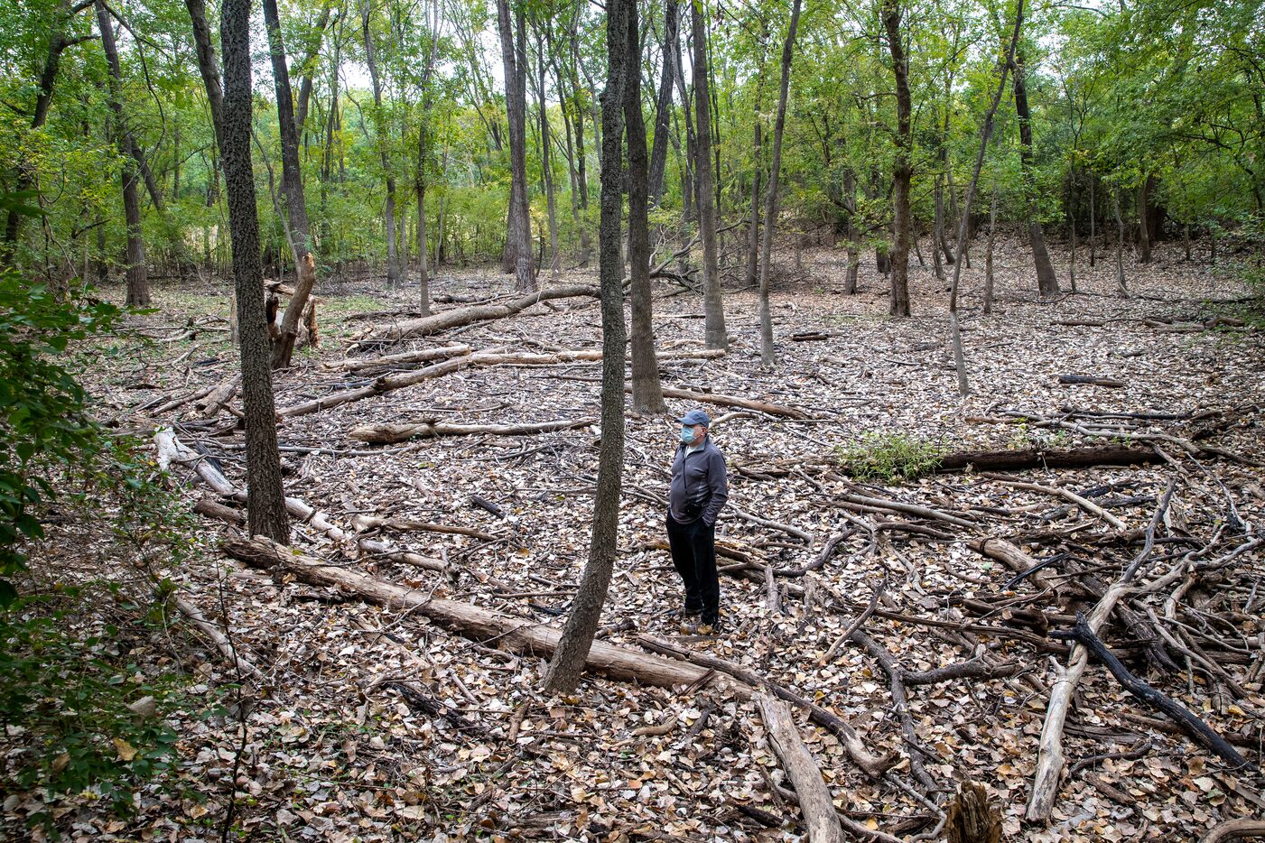 Local naturalist Kelly Cotten stands in an empty pond cell at the Old Fish Hatchery nature...