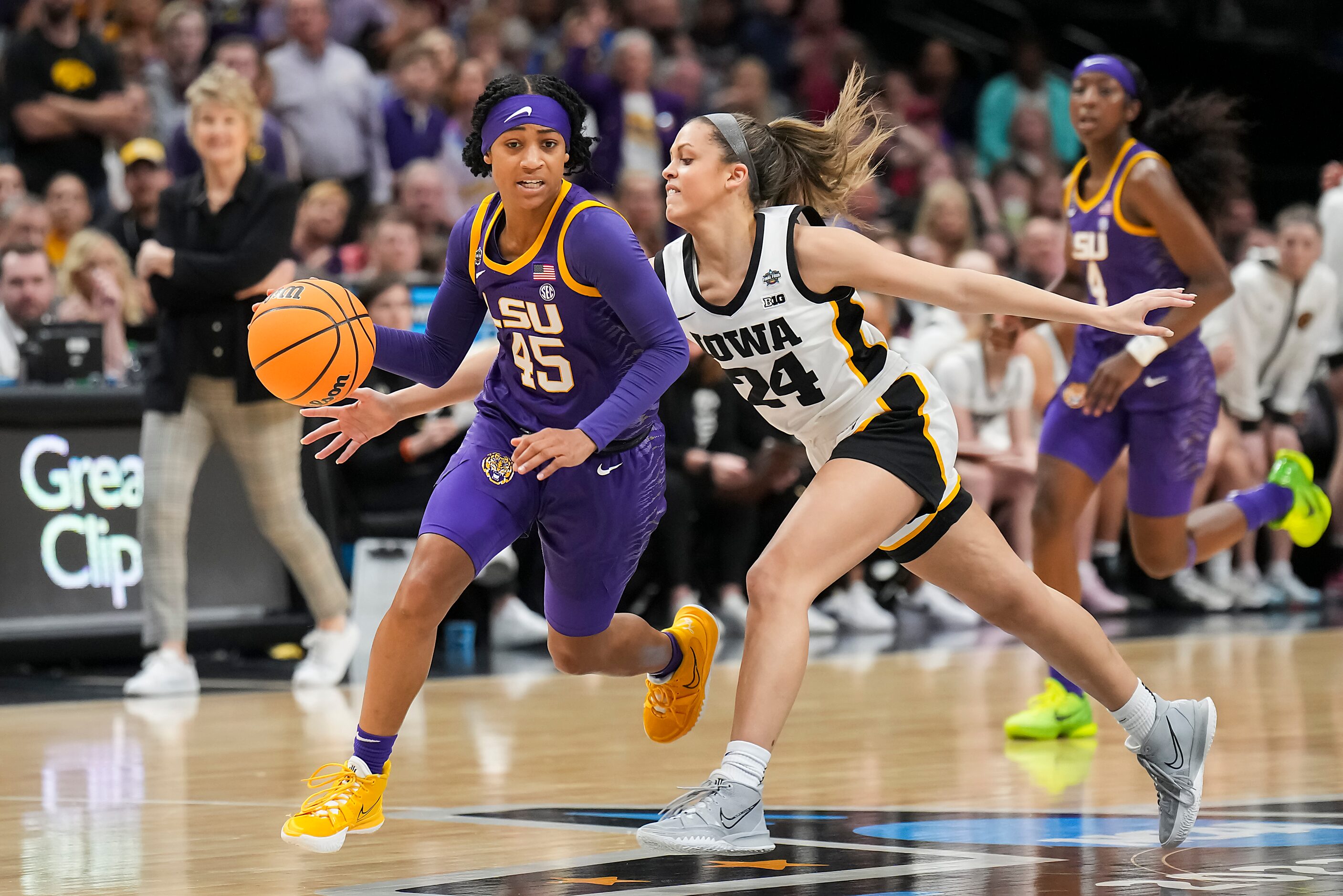 LSU guard Alexis Morris (45) dribbles past Iowa guard Gabbie Marshall (24) during the second...