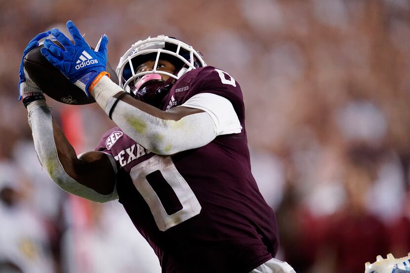 FILE - Texas A&M wide receiver Ainias Smith catches a 25-yard touchdown pass against Alabama...
