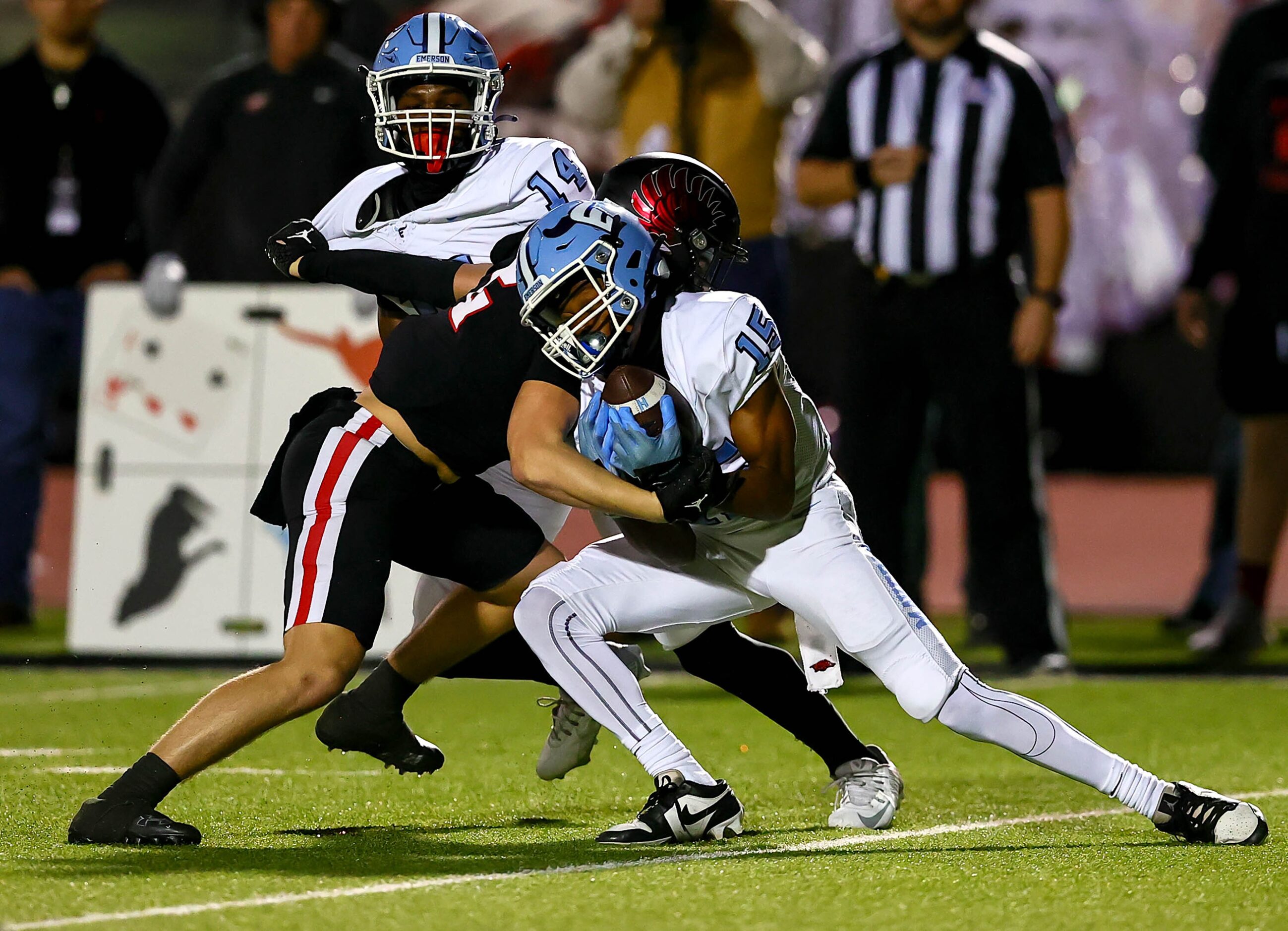 Frisco Emerson wide receiver Cameron Newborn (15) makes a reception and is immediately...