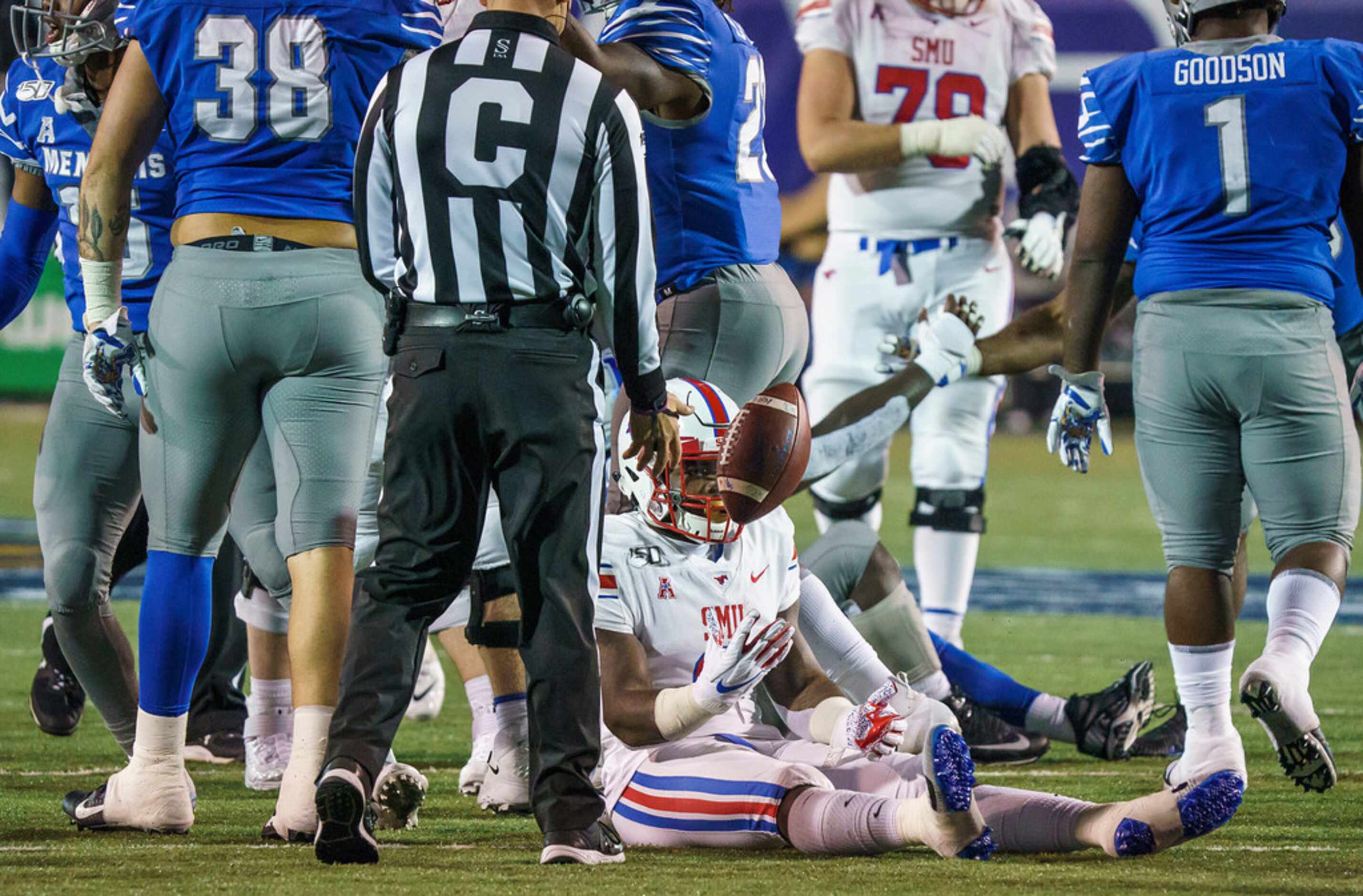 SMU running back Ke'Mon Freeman (2) tosses the ball to the referee after being brought down...