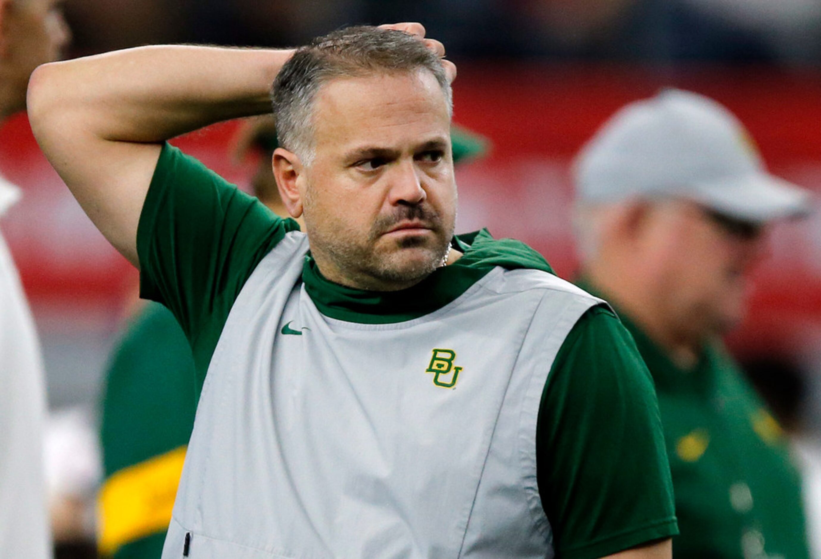 Baylor Bears head coach Matt Rhule watches his team during warm up before facing the...