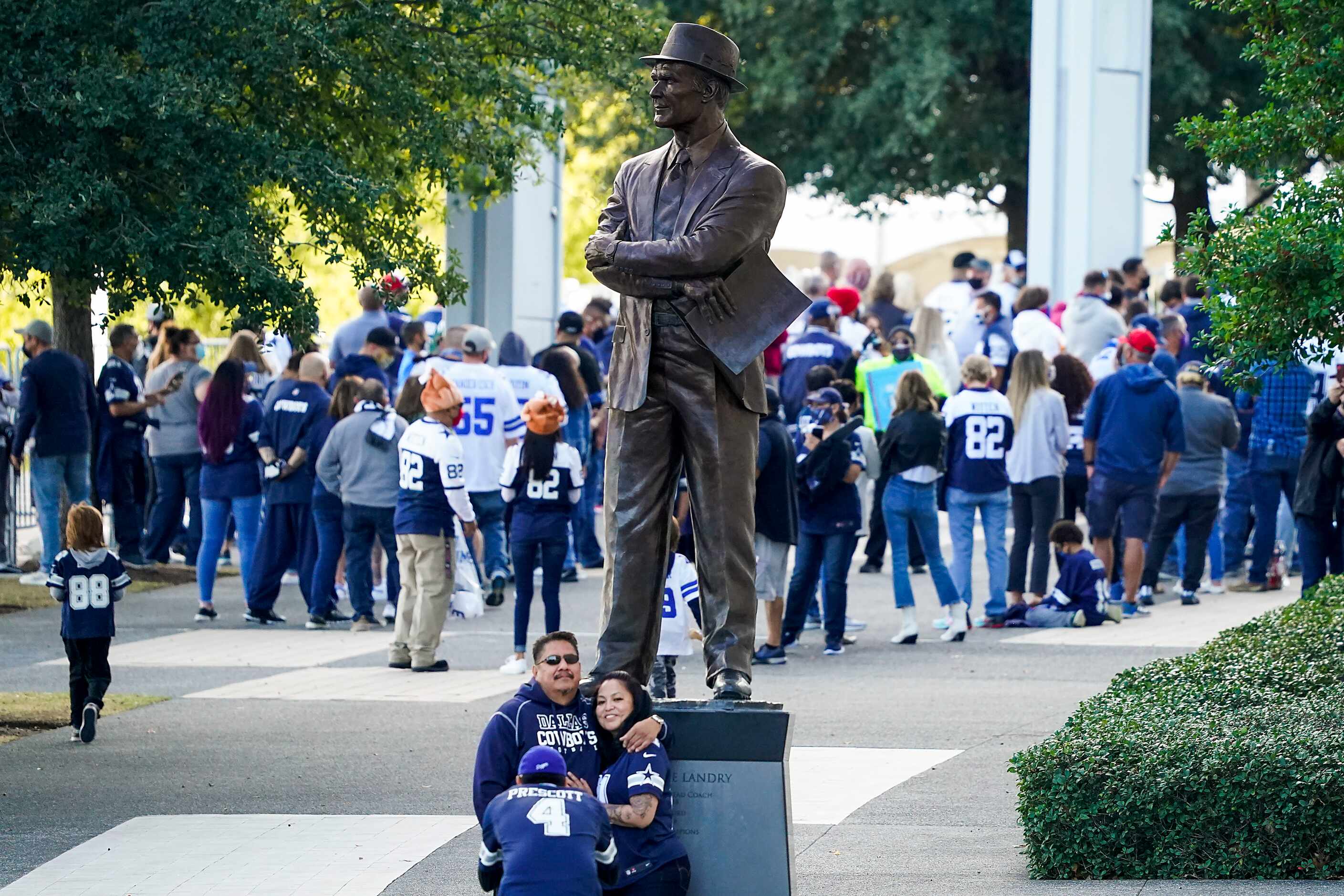 Fans wait for the gates to open before an NFL football game between the Dallas Cowboys and...