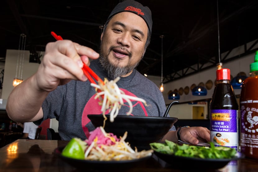 Owner Khanh Nguyen of Dalat Restaurant adds sprouts to his pho.