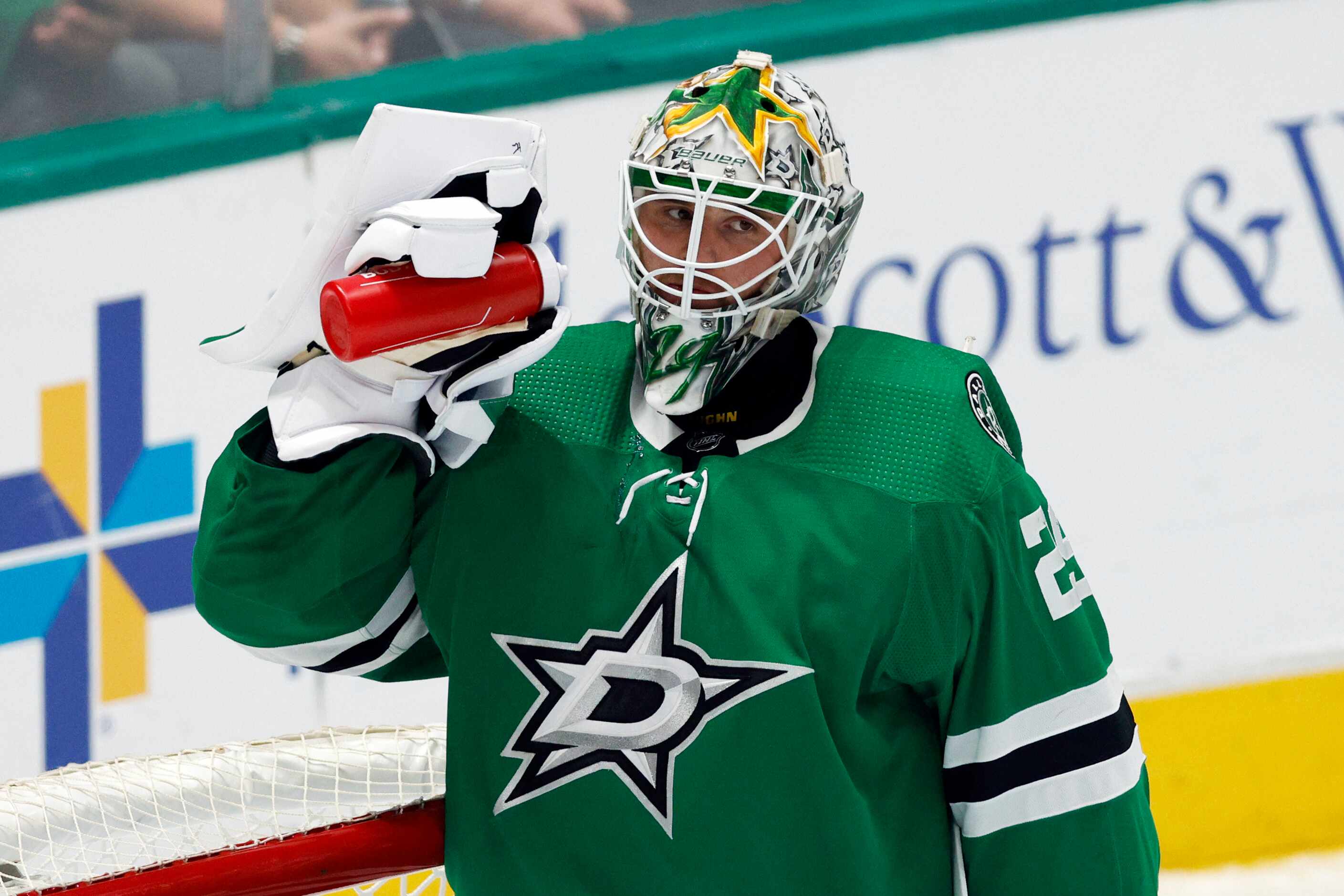 Dallas Stars goaltender Jake Oettinger (29) drinks water during a timeout in the third...
